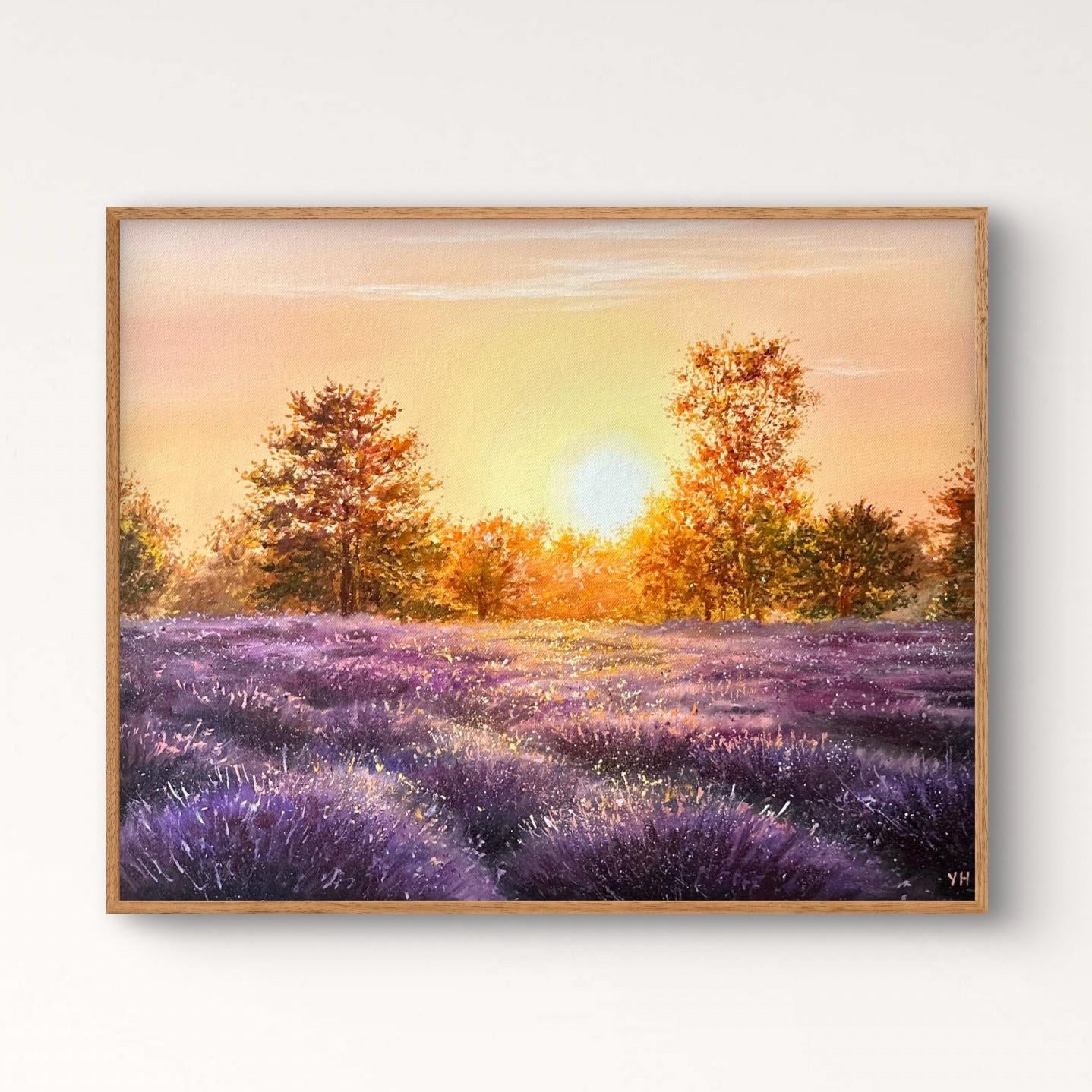 Framed artwork of a sunset over a lavender field with trees.