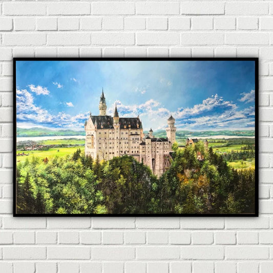 Framed picture of a castle on a white brick wall