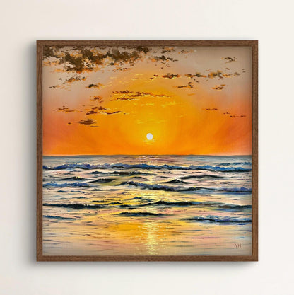 Framed painting of a sunset over the ocean with a wooden frame.